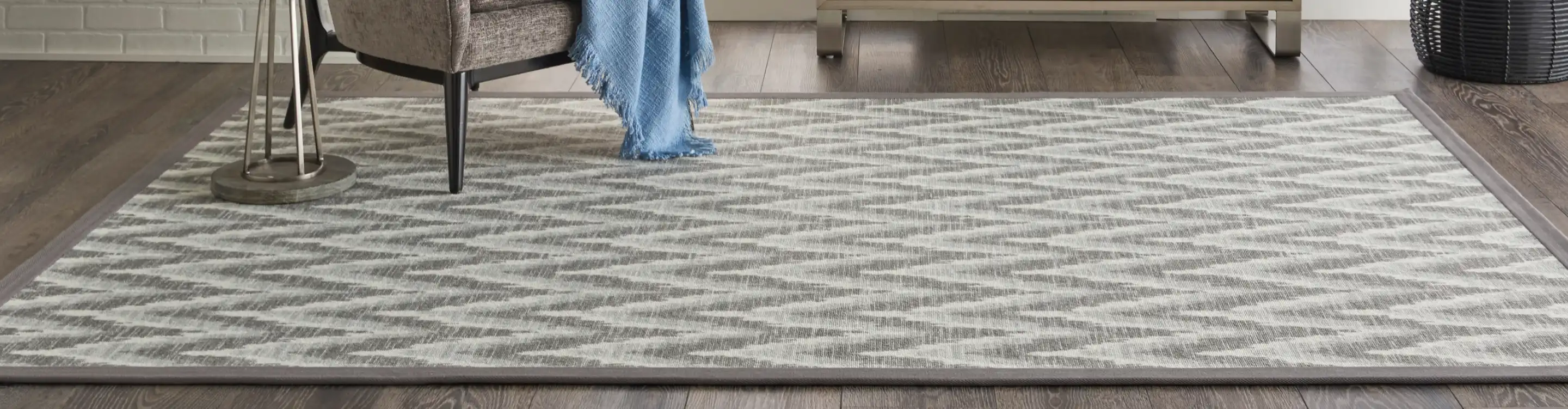 area rug over plank wood flooring